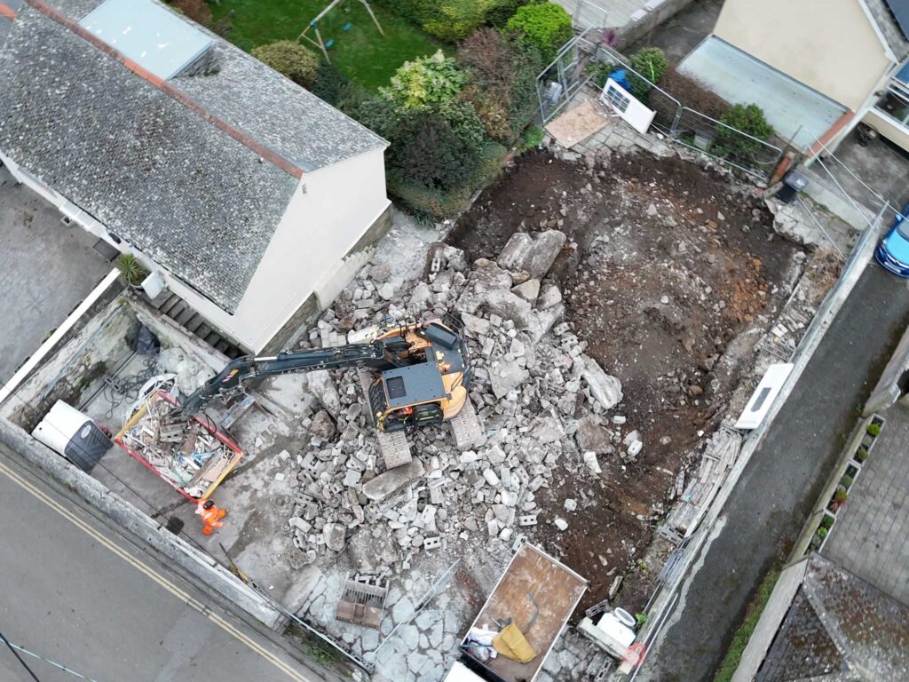 Mechanical demolition of a house in Mousehole, Cornwall